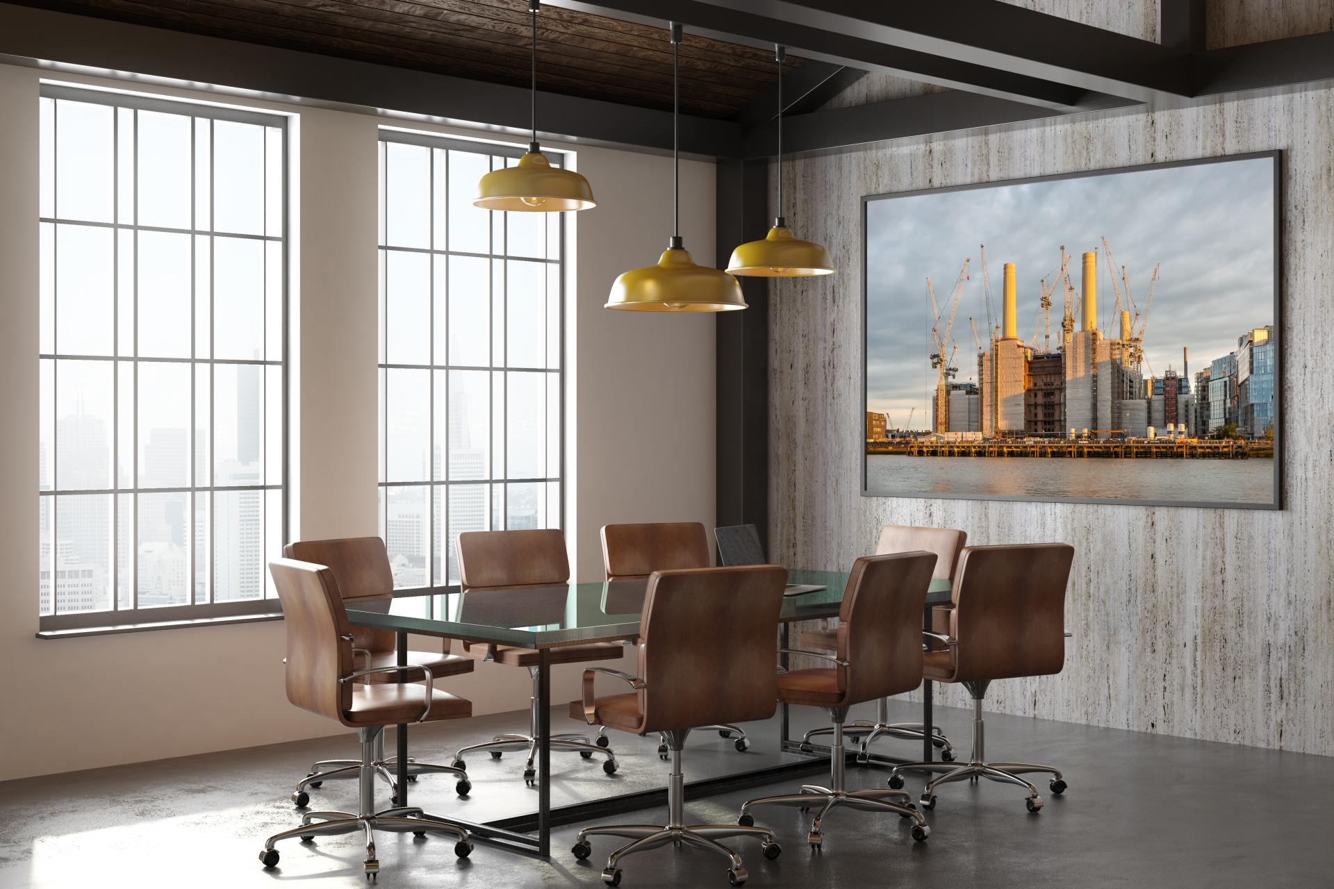 Battersea Power Station taken from the bank opposite with the Thames infront, taken at sunset making all chimneys glow golden