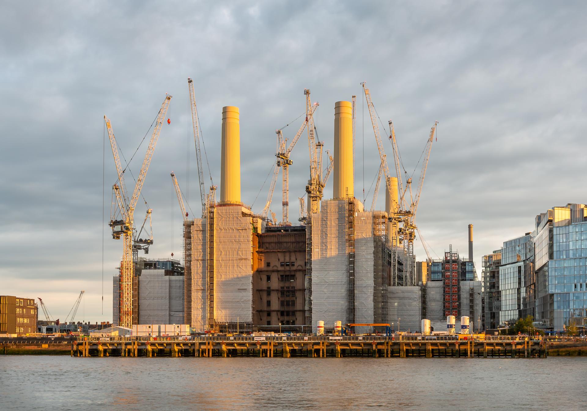 Battersea Power Station taken the hour before sunset which casts a golden light onto the chimneys of the power station. London Interior/Architectural Photography, Liane Ryan Photography