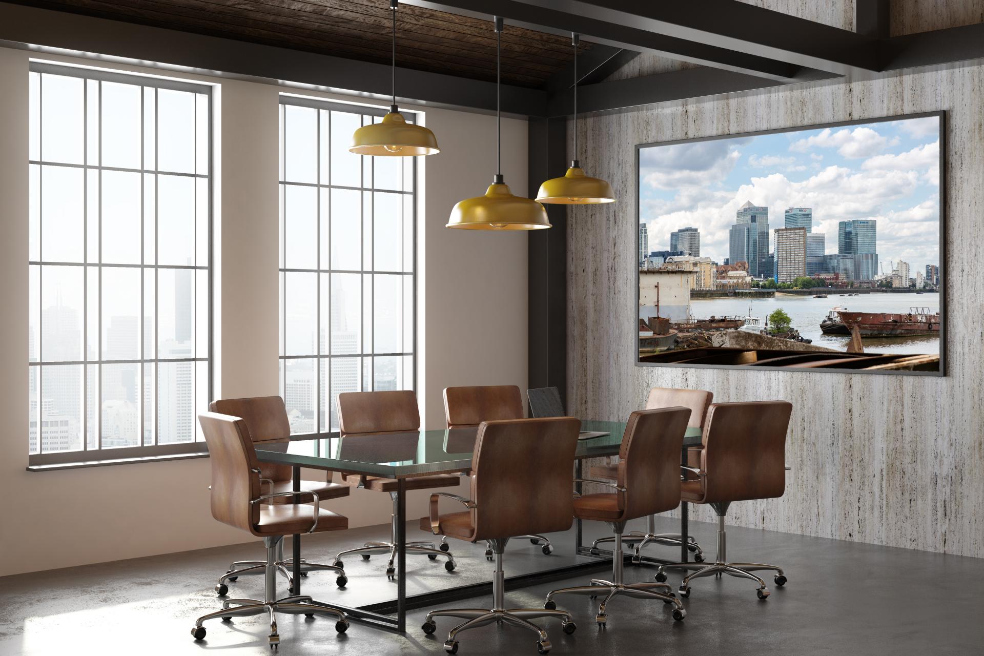 Canary Wharf taken from the Thames Pathway with rusty old barges in the foreground