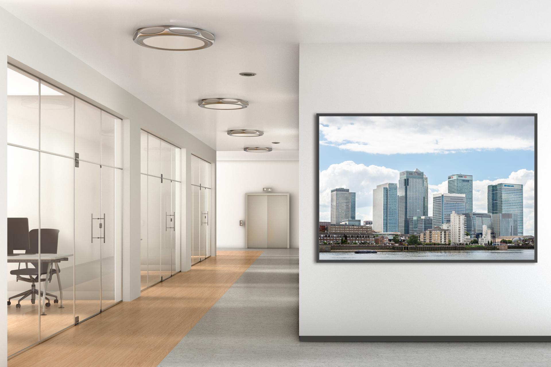 Canary Wharf taken from the Thames Pathway opposite with the thames infront