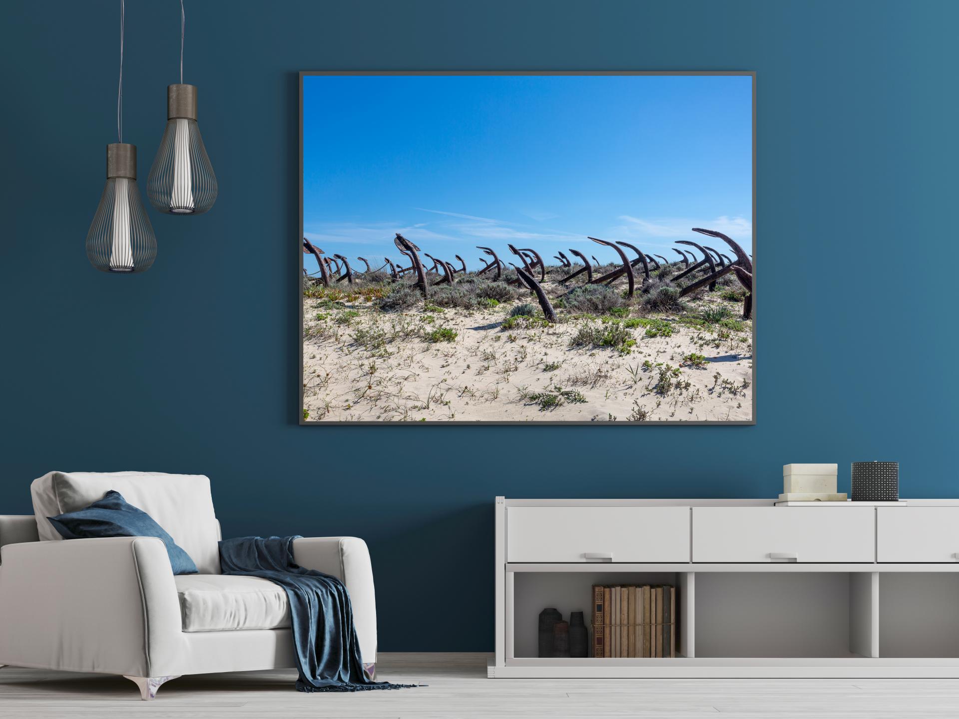 Old tuna boat anchors on the beach at Barril in Tavira, blue skies. Liane Ryan Photography