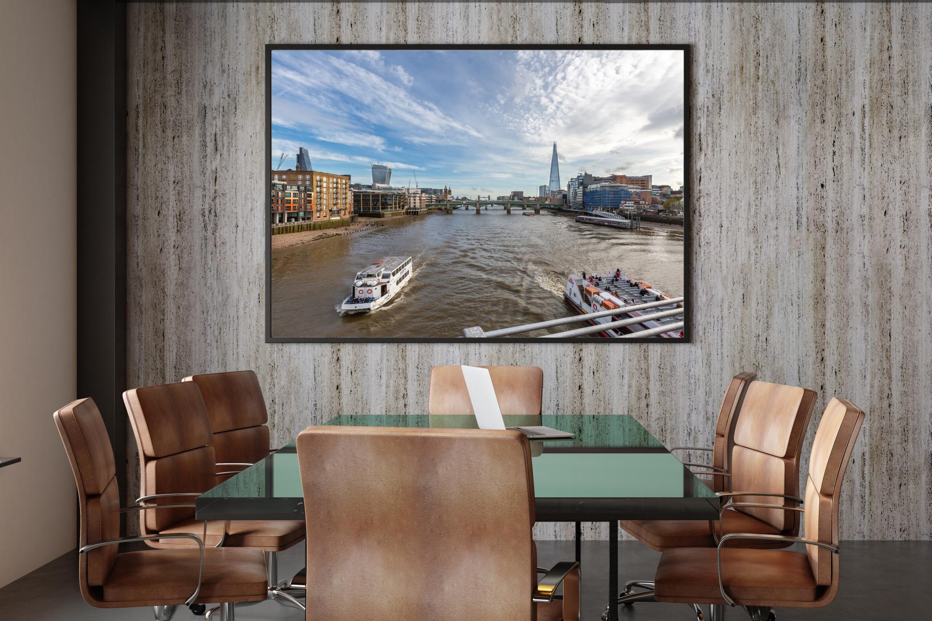 The river thames looking down river from Millenium bridge to Tower Bridge showing the Shard on the right and the Walkie on the left with pleasure boats on the water
