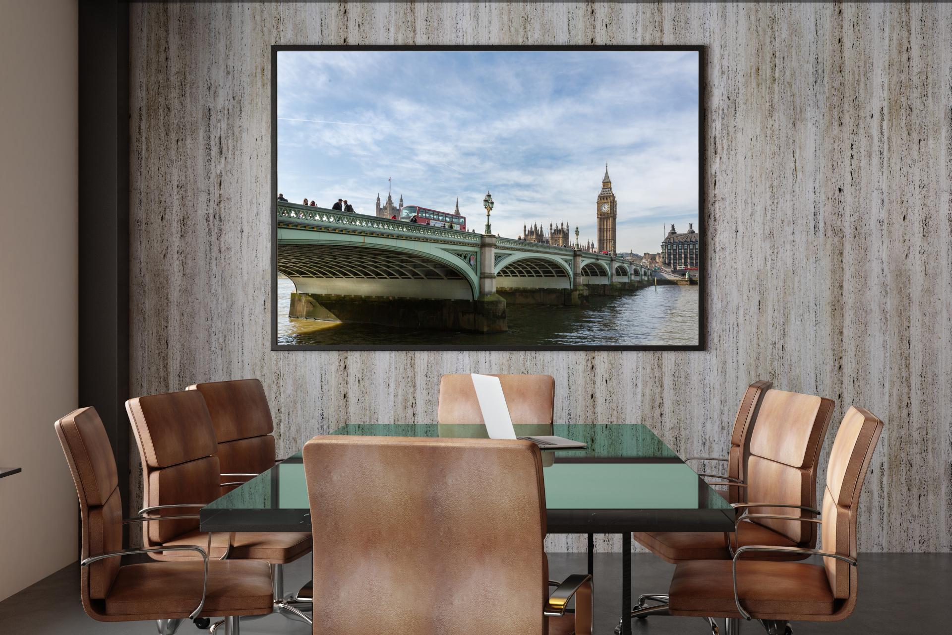 Westminster Bridge with Big Ben on far side and a red bus going over the bridge